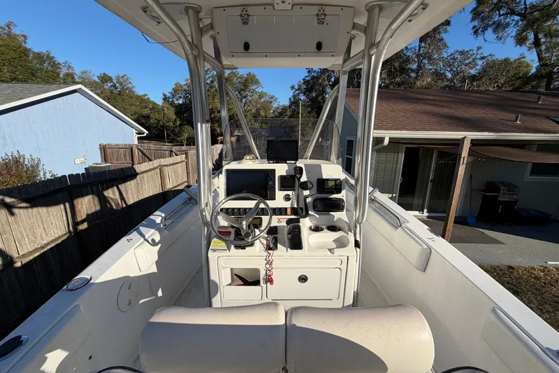 Slide: The Image of 2015 Sea Hunt Ultra 225 boat interior with steering console and navigation equipment. - 21