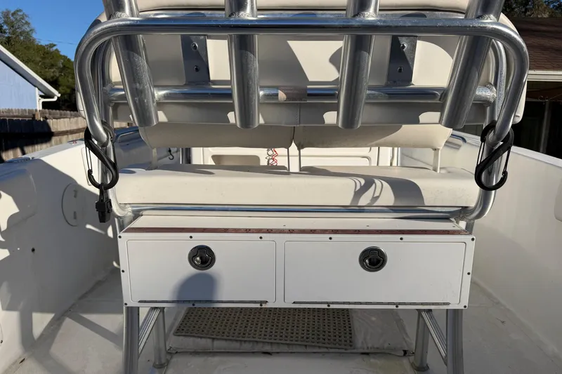 Slide: The Image of 2015 Sea Hunt Ultra 225 boat interior with seating and storage compartments. - 23