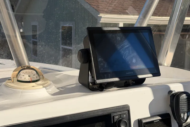 Slide: The Image of 2015 Sea Hunt Ultra 225 dashboard with Garmin GPS and Ritchie compass. - 26