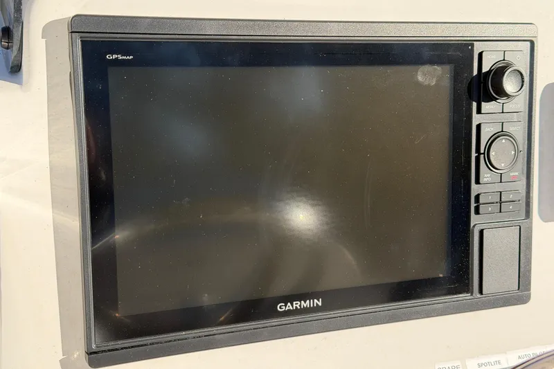 Slide: The Image of Garmin GPSMAP device on 2015 Sea Hunt Ultra 225 boat dashboard. - 27
