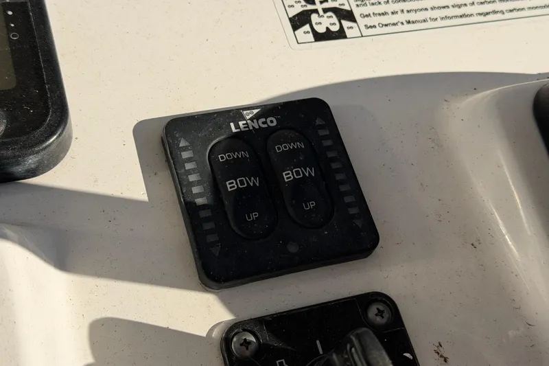 Slide: The Image of Lenco trim tab control on 2015 Sea Hunt Ultra 225 boat dashboard. - 32