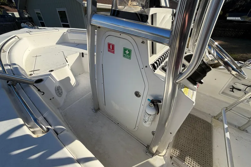 Slide: The Image of 2015 Sea Hunt Ultra 225 boat interior with safety equipment and steering console. - 38