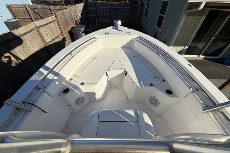 Slide: The Image of 2015 Sea Hunt Ultra 225 boat interior with seating and storage compartments. - 42