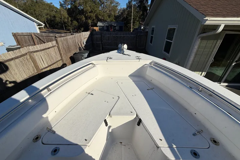 Slide: The Image of 2015 Sea Hunt Ultra 225 boat deck in residential backyard setting. - 43