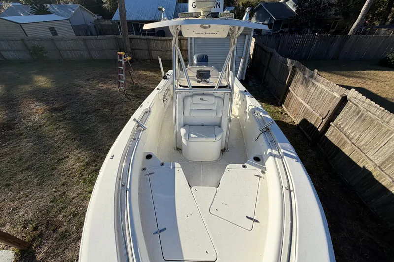 Slide: The Image of 2015 Sea Hunt Ultra 225 boat in a backyard, viewed from above. - 47