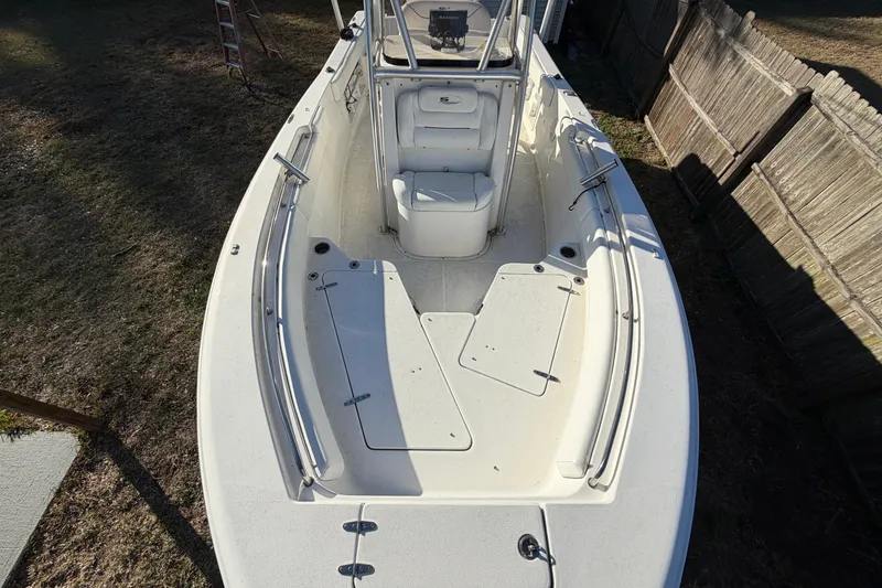 Slide: The Image of 2015 Sea Hunt Ultra 225 boat, top view, showcasing spacious deck and seating. - 48