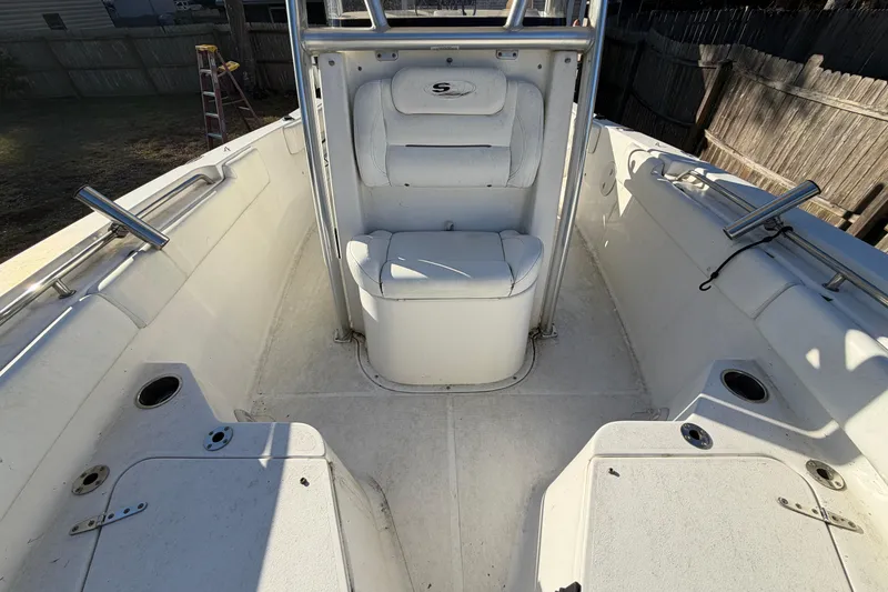 Slide: The Image of 2015 Sea Hunt Ultra 225 boat interior with seating and rod holders. - 51