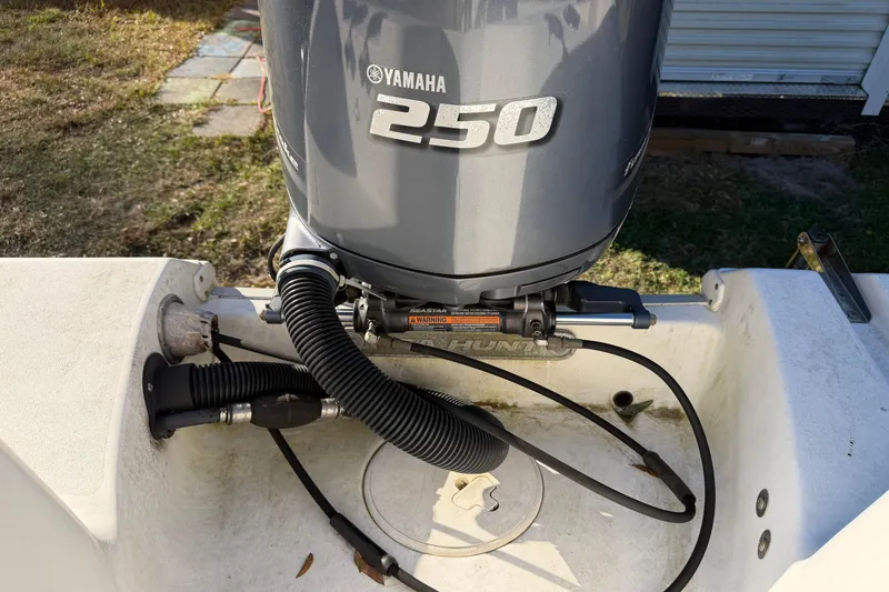 Slide: The Image of 2015 Sea Hunt Ultra 225 with Yamaha 250 outboard motor, rear view. - 61