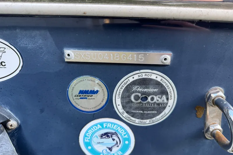 Slide: The Image of 2015 Sea Hunt Ultra 225 boat with certification and Coosa Composites label. - 62