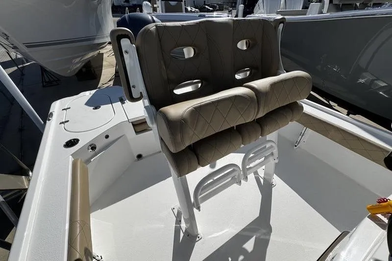 Slide: The Image of 2026 Blazer Bay 2400 boat seat with beige cushioned design and sturdy frame. - 17