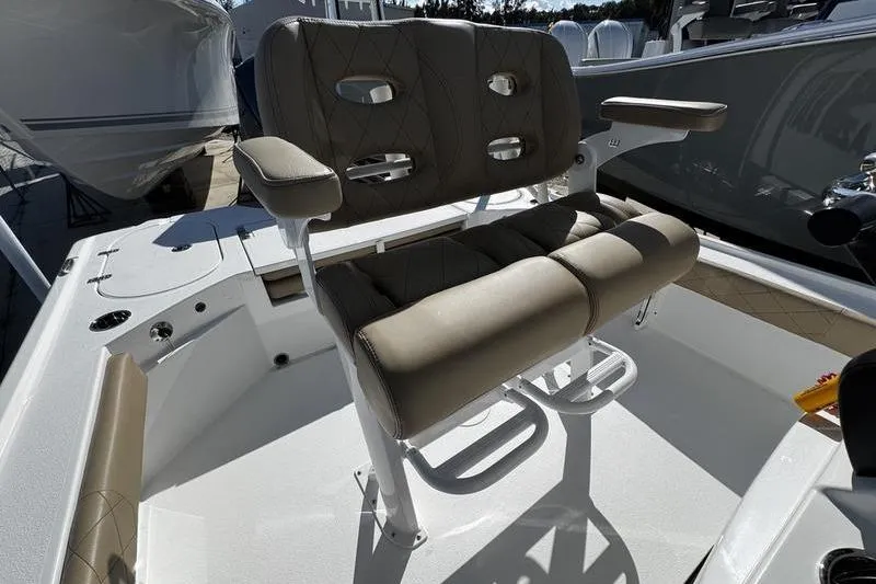 Slide: The Image of 2026 Blazer Bay 2400 boat seat with cushioned armrests and modern design. - 18