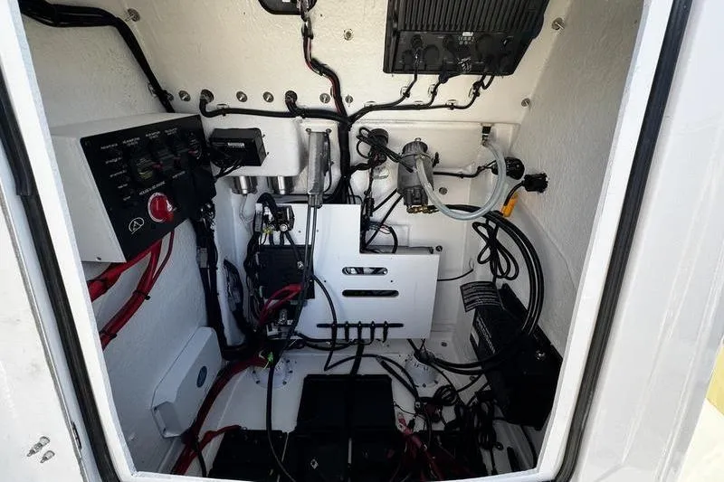 Slide: The Image of Electrical system inside a 2026 Blazer Bay 2400 boat, featuring wiring and components. - 11