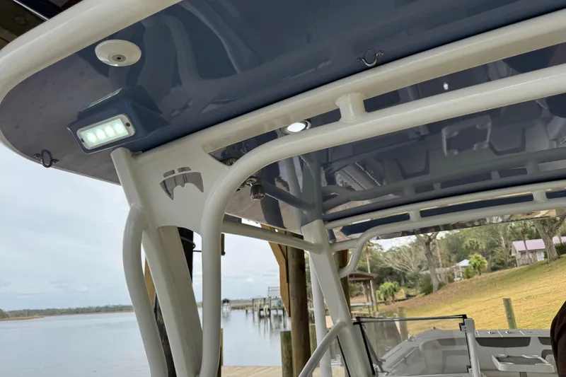 Slide: The Image of 2023 World Cat 280 DC-X boat canopy with LED lights, dockside view. - 19