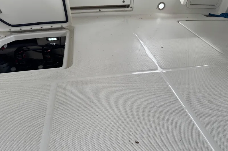 Slide: The Image of 2023 World Cat 280 DC-X boat deck with open hatch revealing internal components. - 20