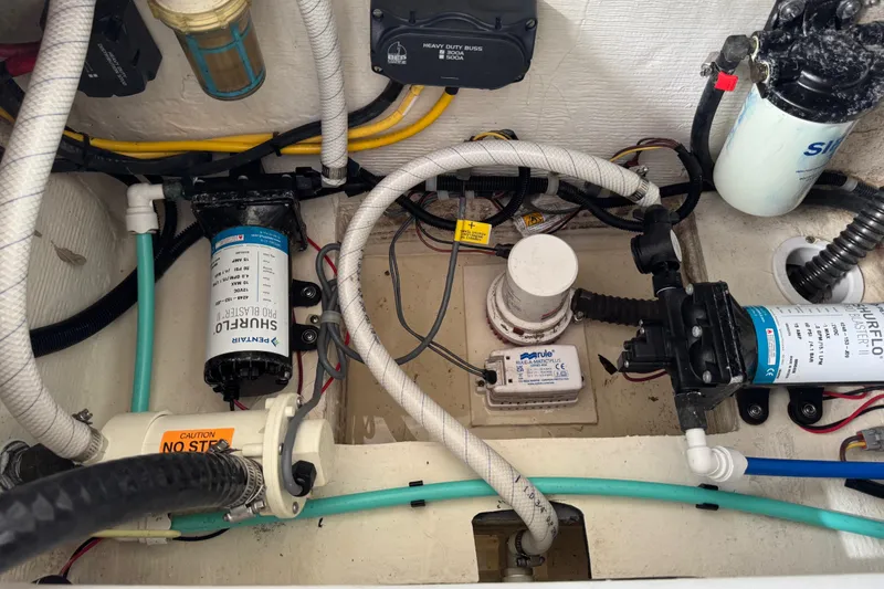 Slide: The Image of Engine compartment of 2023 World Cat 280 DC-X with pumps and wiring. - 23