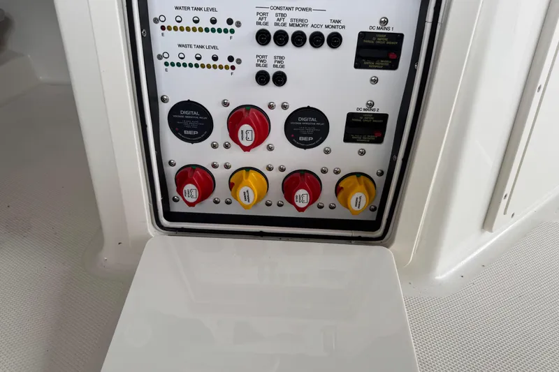 Slide: The Image of Control panel of 2023 World Cat 280 DC-X boat with switches and indicators. - 24