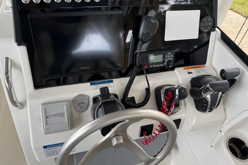 Slide: The Image of Helm of 2023 World Cat 280 DC-X with Garmin display and controls. - 27