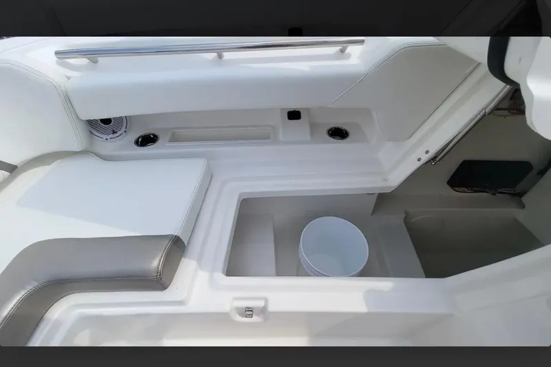 Slide: The Image of Interior view of 2023 World Cat 280 DC-X boat, featuring seating and storage compartments. - 5