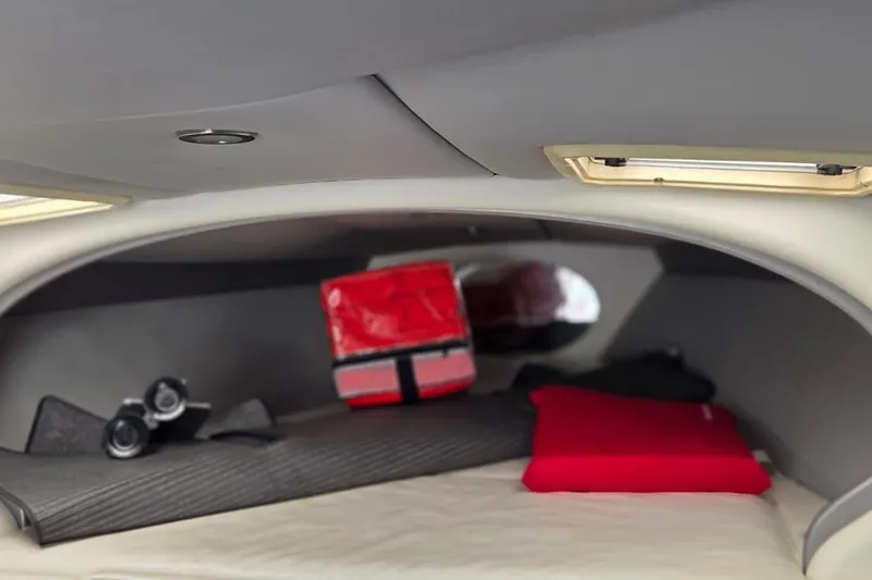 Slide: The Image of Interior of 2004 Formula 292 FASTech boat with white seating and storage. - 10