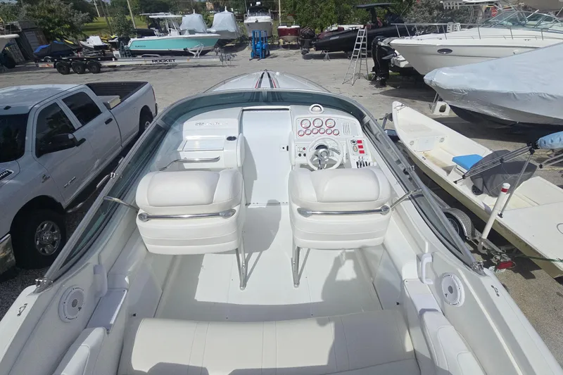 Slide: The Image of 2004 Formula 292 FASTech boat interior with white seating and control panel. - 3
