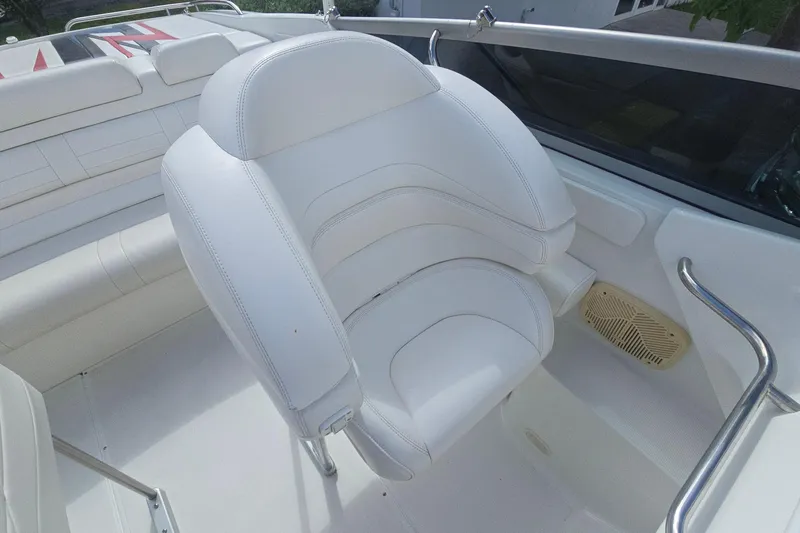 Slide: The Image of 2004 Formula 292 FASTech boat cockpit with steering wheel and control panel. - 5