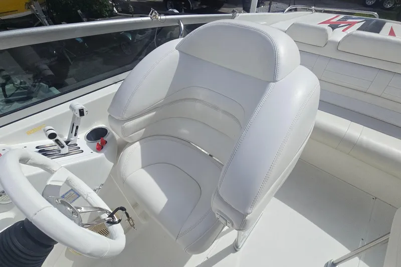 Slide: The Image of 2004 Formula 292 FASTech boat interior with white seating and stainless steel handrail. - 6