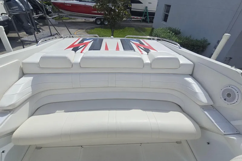 Slide: The Image of 2004 Formula 292 FASTech boat interior with white leather seating and sleek design. - 7