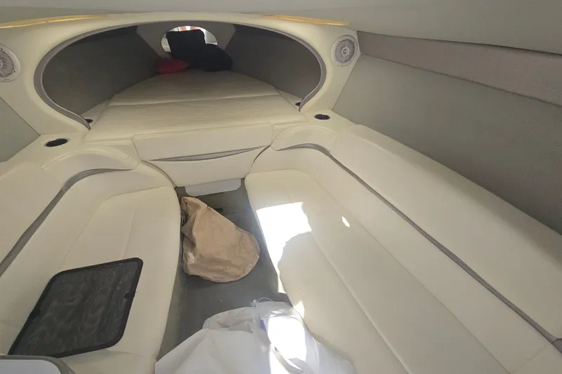 Slide: The Image of 2004 Formula 292 FASTech boat interior with white leather seating and steering wheel. - 8