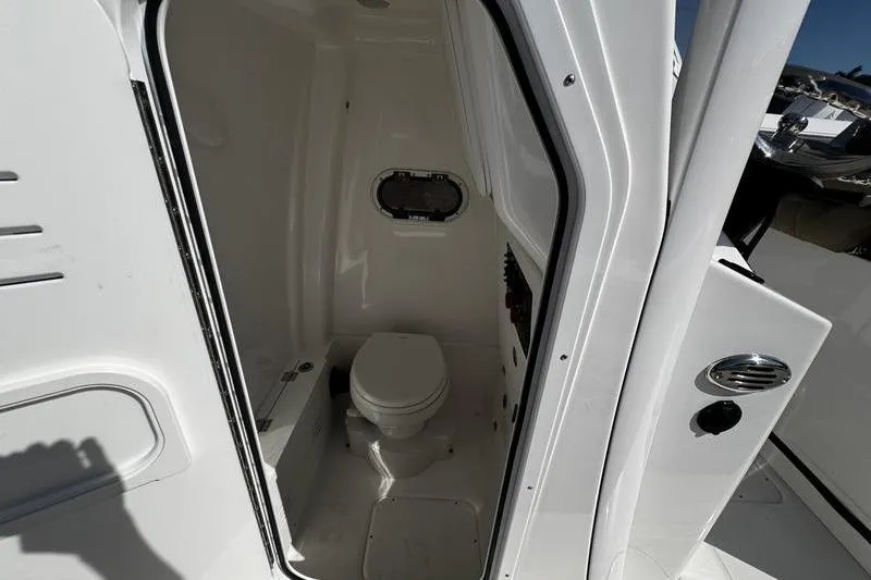 Slide: The Image of 2026 Blazer Bay Makaira 2800 boat interior with compact marine toilet. - 10