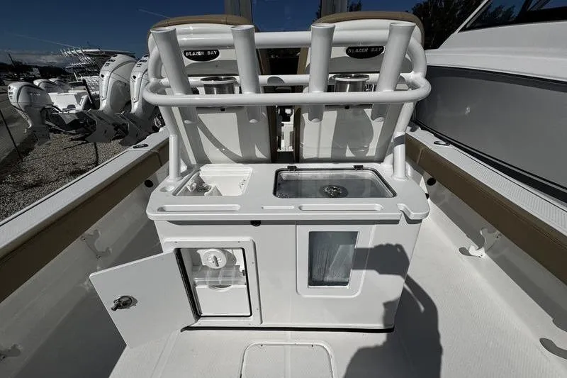 Slide: The Image of 2026 Blazer Bay Makaira 2800 boat interior with storage and seating features. - 20