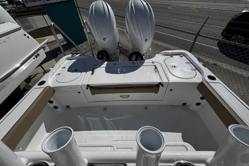 Slide: The Image of 2026 Blazer Bay Makaira 2800 boat with dual outboard motors, viewed from the rear deck. - 21