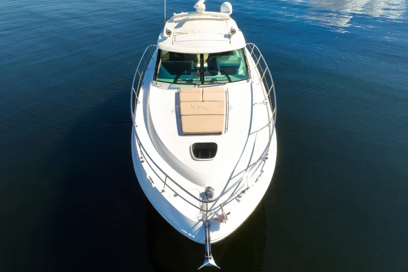 Slide: The Image of 2015 Sea Ray 410 Sundancer yacht on calm water, aerial view. - 10