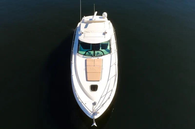 Slide: The Image of Overhead view of 2015 Sea Ray 410 Sundancer yacht on calm water. - 11