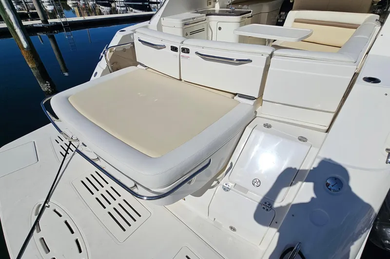 Slide: The Image of 2015 Sea Ray 410 Sundancer yacht with spacious seating and sleek design. - 19