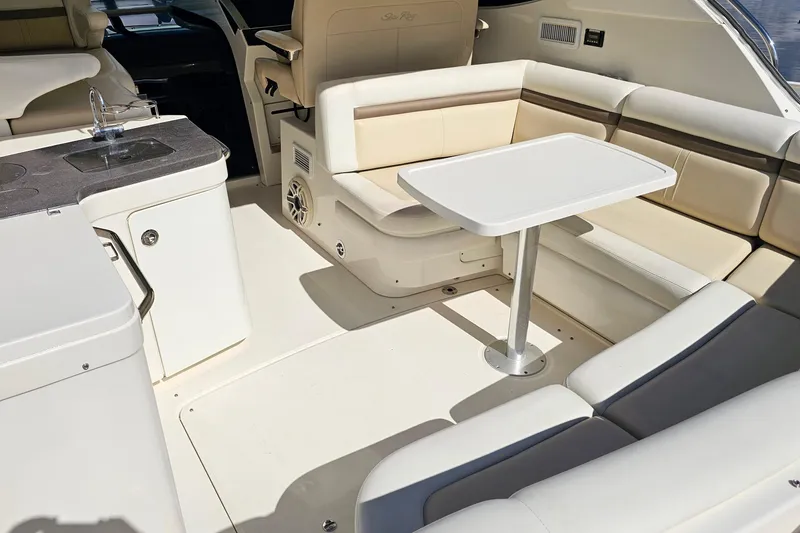 Slide: The Image of Luxurious interior of 2015 Sea Ray 410 Sundancer yacht with seating and table. - 21