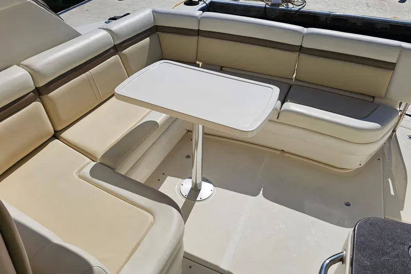Slide: The Image of Luxurious seating area on 2015 Sea Ray 410 Sundancer yacht with table. - 24