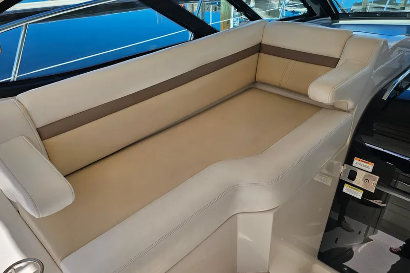Slide: The Image of Luxurious seating on 2015 Sea Ray 410 Sundancer yacht, featuring beige and brown upholstery. - 36