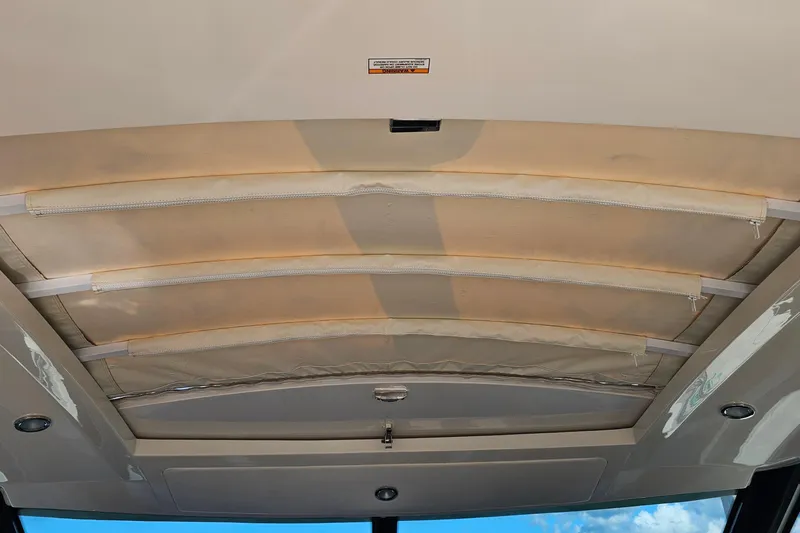 Slide: The Image of Ceiling view of 2015 Sea Ray 410 Sundancer boat with retractable sunroof. - 38