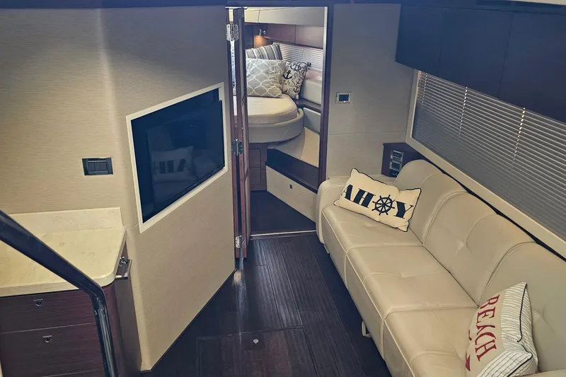 Slide: The Image of Luxurious interior of 2015 Sea Ray 410 Sundancer yacht with cozy seating and modern amenities. - 47