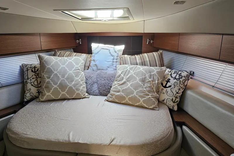 Slide: The Image of Luxurious cabin interior of 2015 Sea Ray 410 Sundancer with decorative pillows. - 48