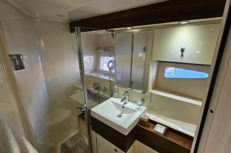 Slide: The Image of Luxurious bathroom interior of 2015 Sea Ray 410 Sundancer yacht with modern fixtures. - 50