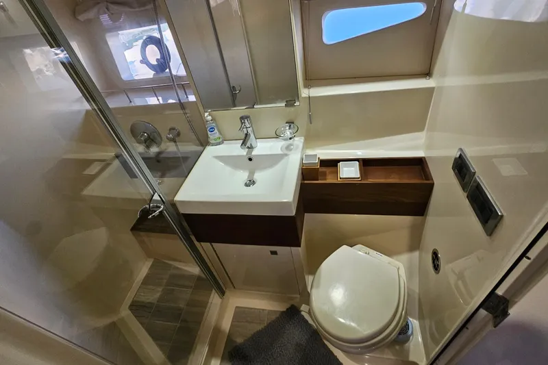 Slide: The Image of Luxurious bathroom in 2015 Sea Ray 410 Sundancer yacht with modern fixtures. - 51