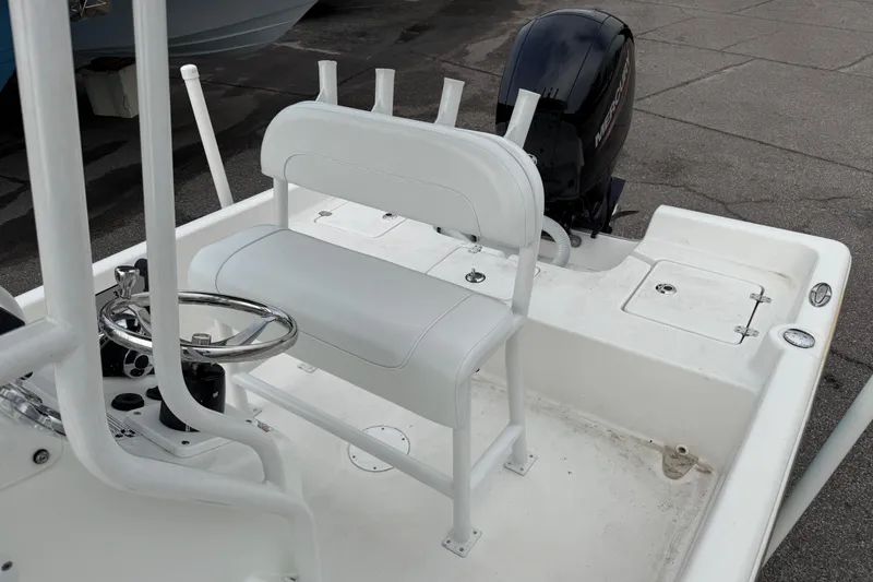 Slide: The Image of 2022 Clearwater 2100 Baystar boat interior with steering wheel and seating. - 13