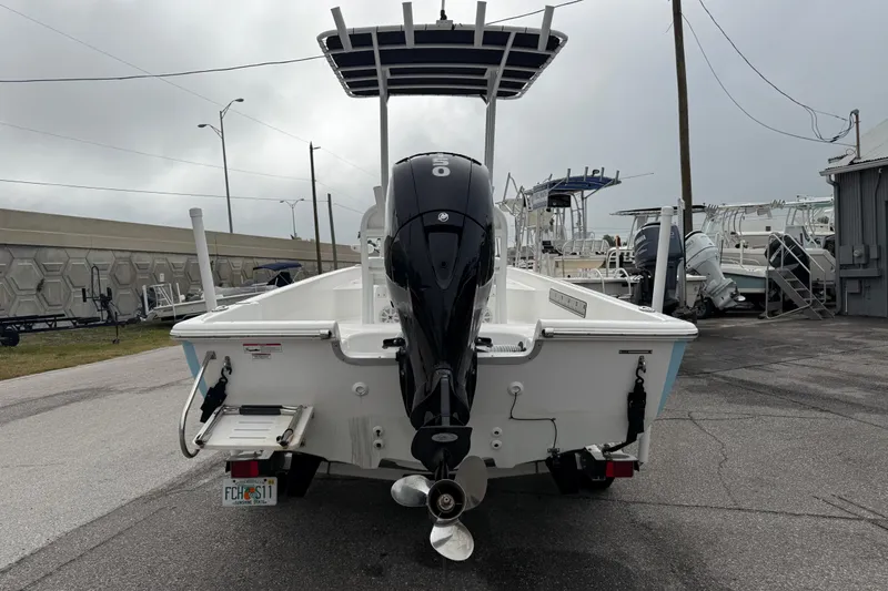 Slide: The Image of 2022 Clearwater 2100 Baystar boat with outboard motor, parked on a trailer. - 4