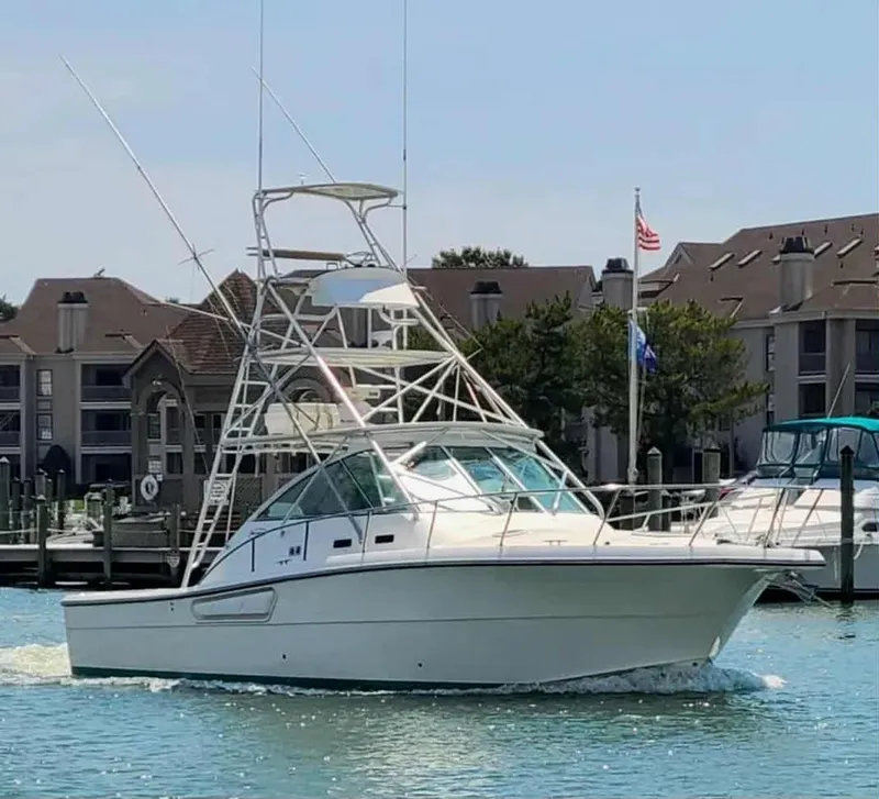 Slide: The Image of 2002 Rampage 38 Express boat in harbor, sunny day. - 1