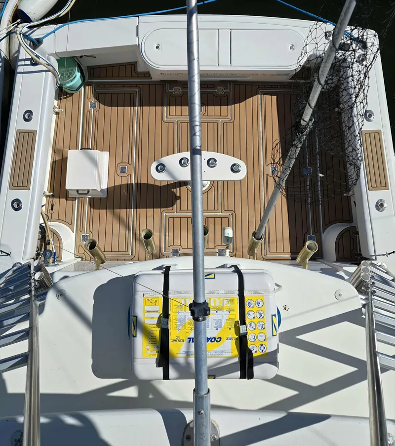 Slide: The Image of Deck of a 2002 Rampage 38 Express boat with fishing gear. - 11
