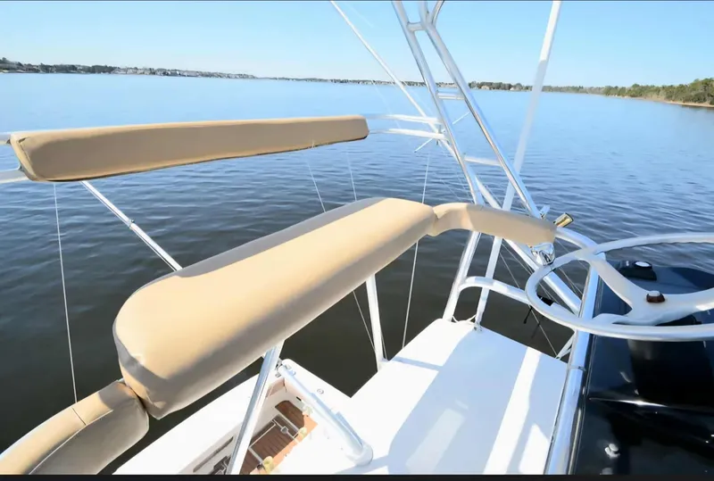 Slide: The Image of 2002 Rampage 38 Express boat on calm water. - 17