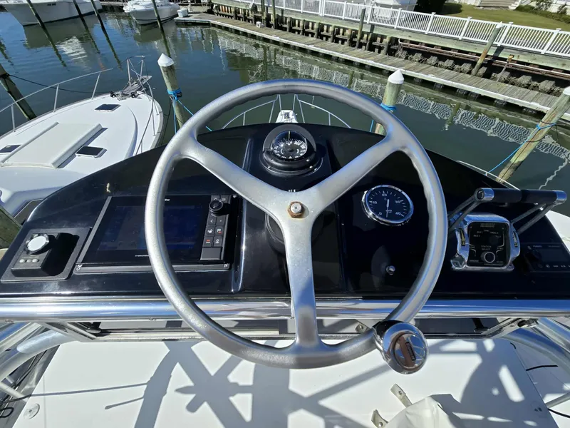 Slide: The Image of Helm of 2002 Rampage 38 Express at dock. - 19