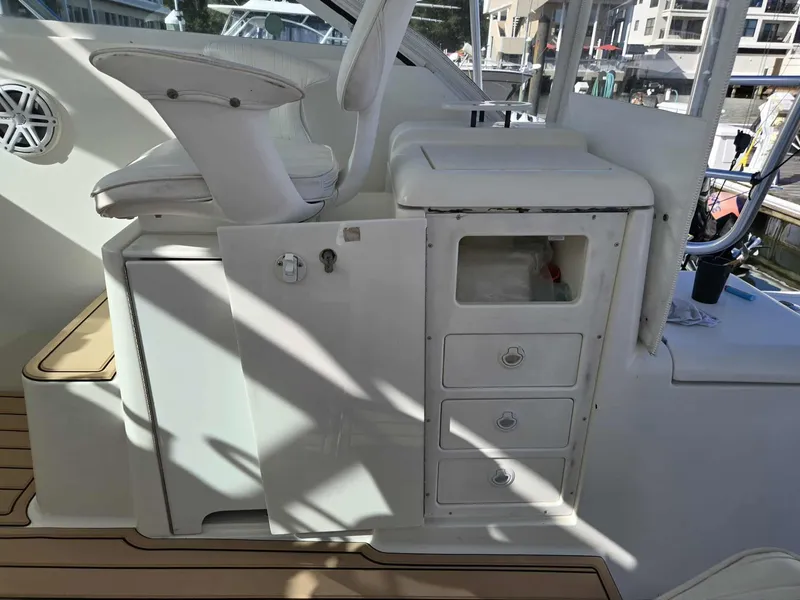 Slide: The Image of Interior of a 2002 Rampage 38 Express boat with seat and cabinets. - 22
