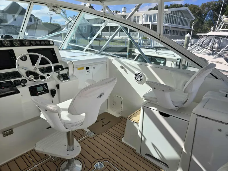 Slide: The Image of Interior of 2002 Rampage 38 Express yacht cockpit. - 23